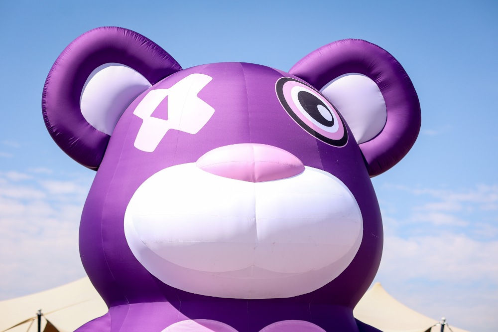 Large purple KISSTORY rave bear installation
