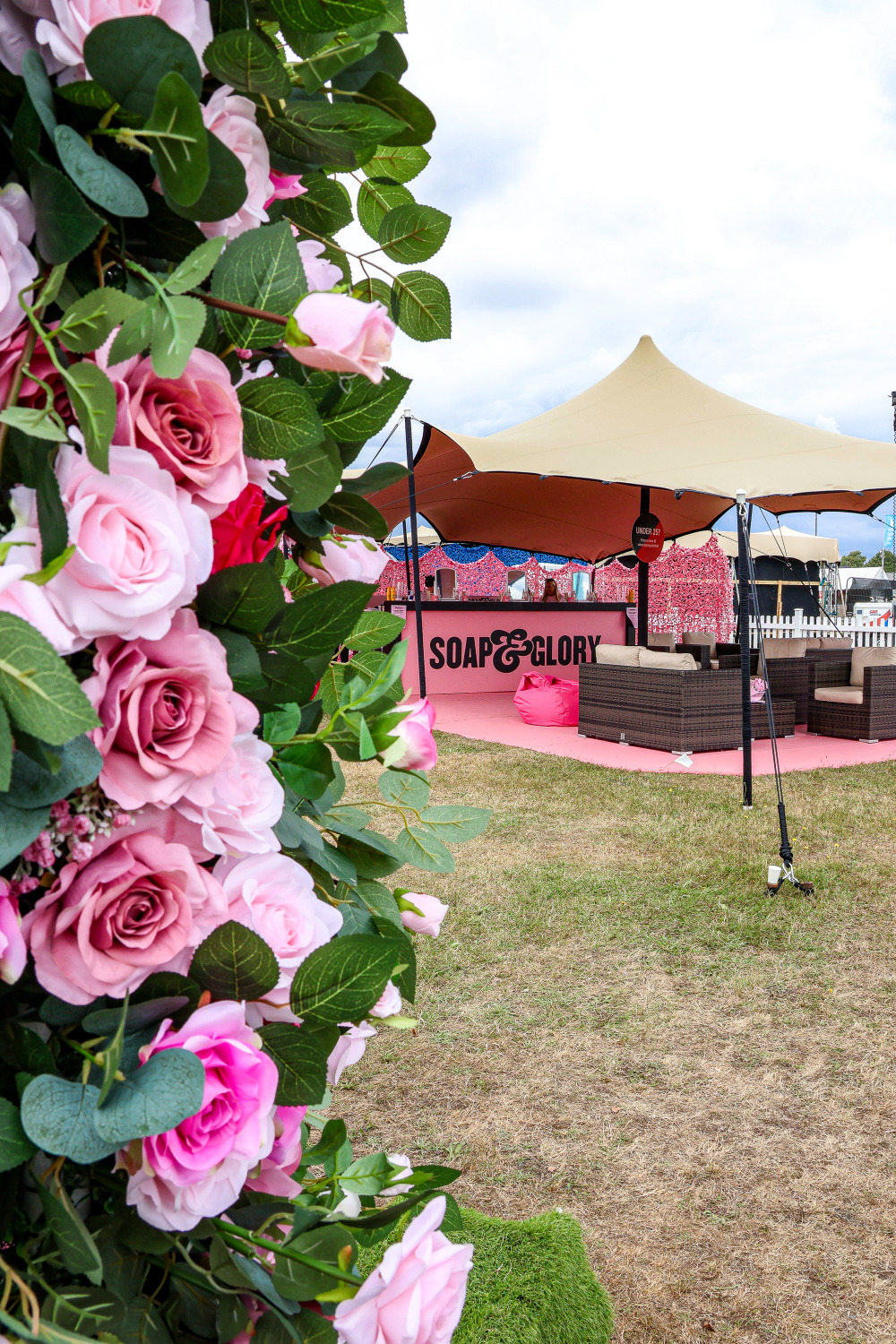 Soap and Glory pamper lounge with a floral entrance and pink bar