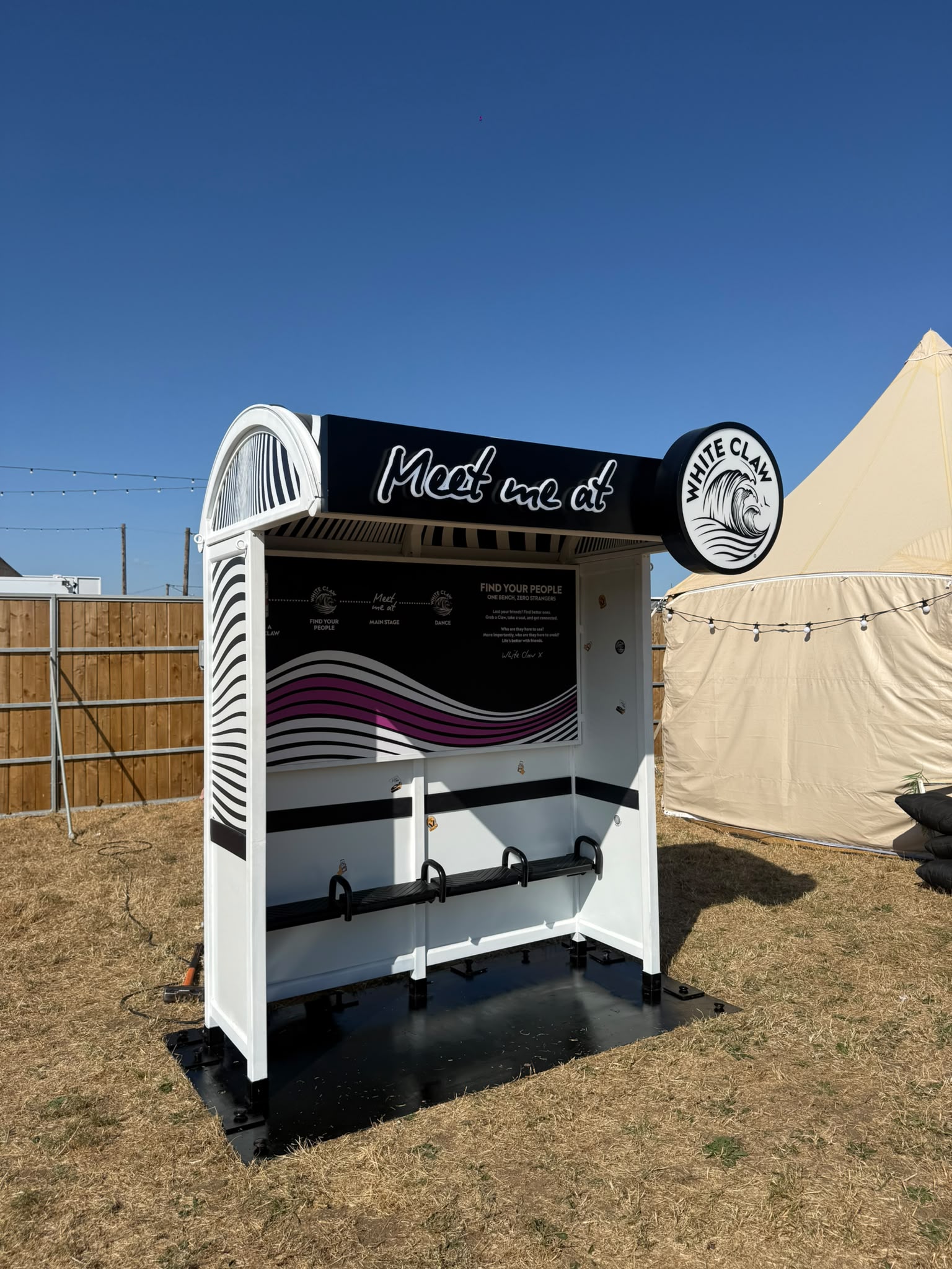 White Claw bus stop installation at a festival