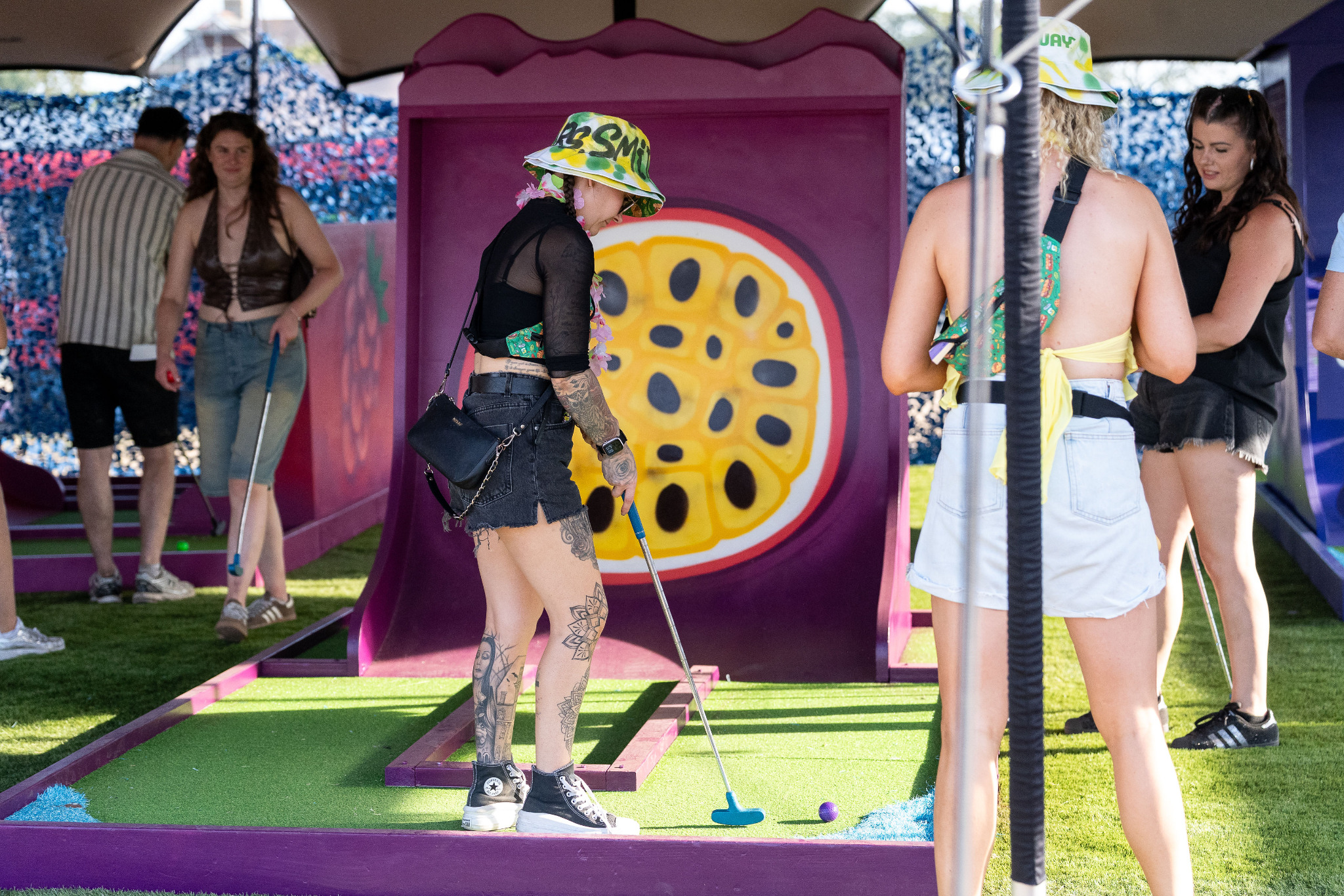 Guests playing a live-event crazy golf installation